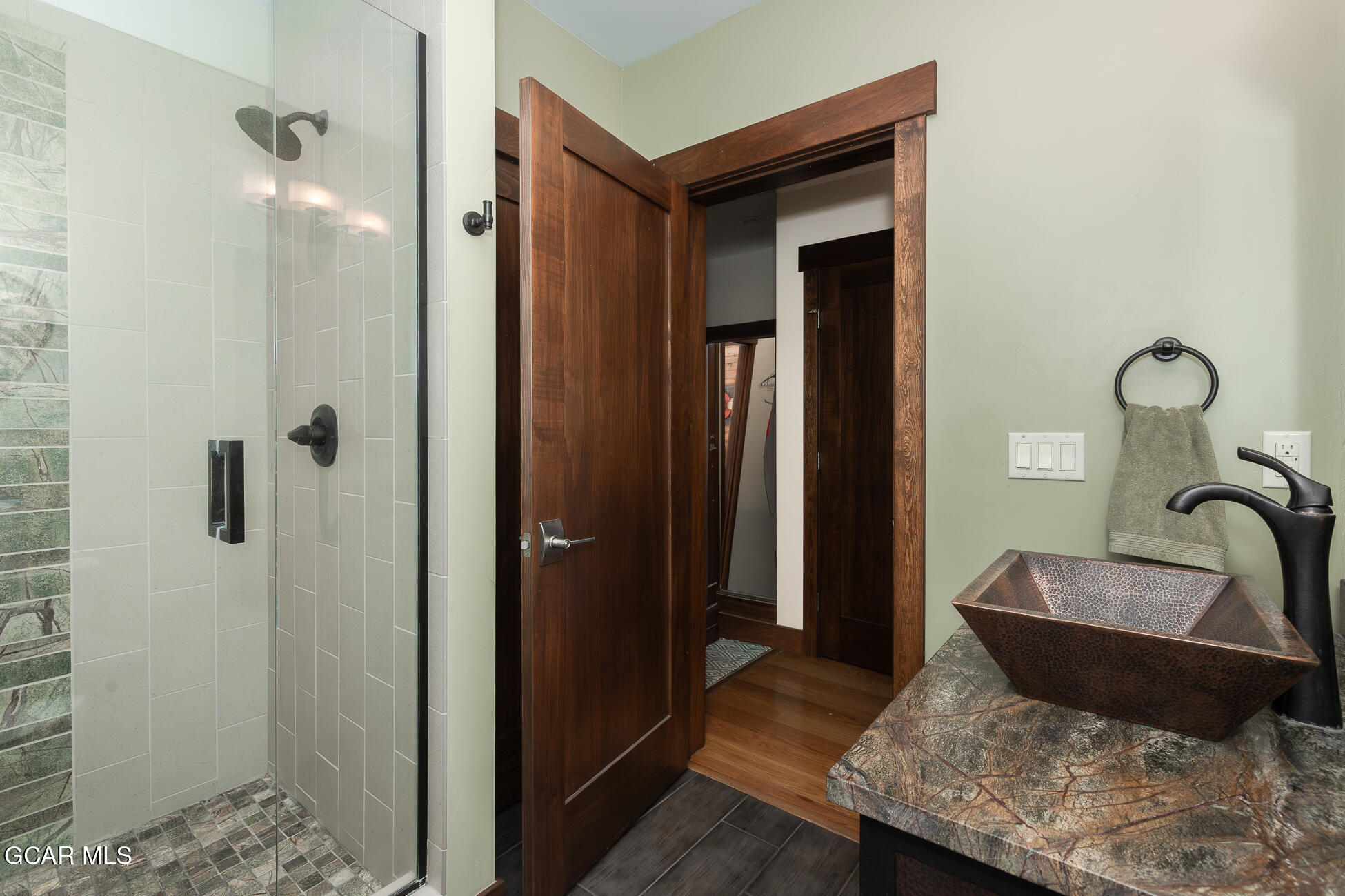 492 Mountain Peak Road Tabernash, CO 80478 - Photo 15 of 29 a bathroom with a granite countertop sink and a mirror