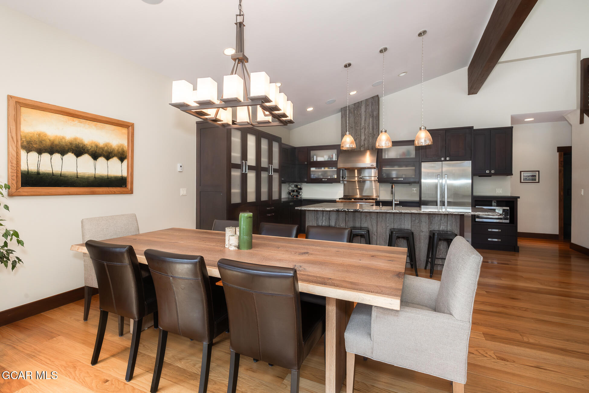 492 Mountain Peak Road Tabernash, CO 80478 - Photo 25 of 29 a view of a dining room with furniture a chandelier and wooden floor