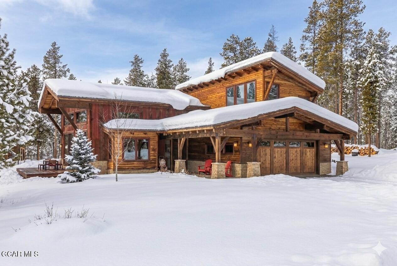 492 Mountain Peak Road Tabernash, CO 80478 - Photo 3 of 29 a view of a house with a yard and roof deck