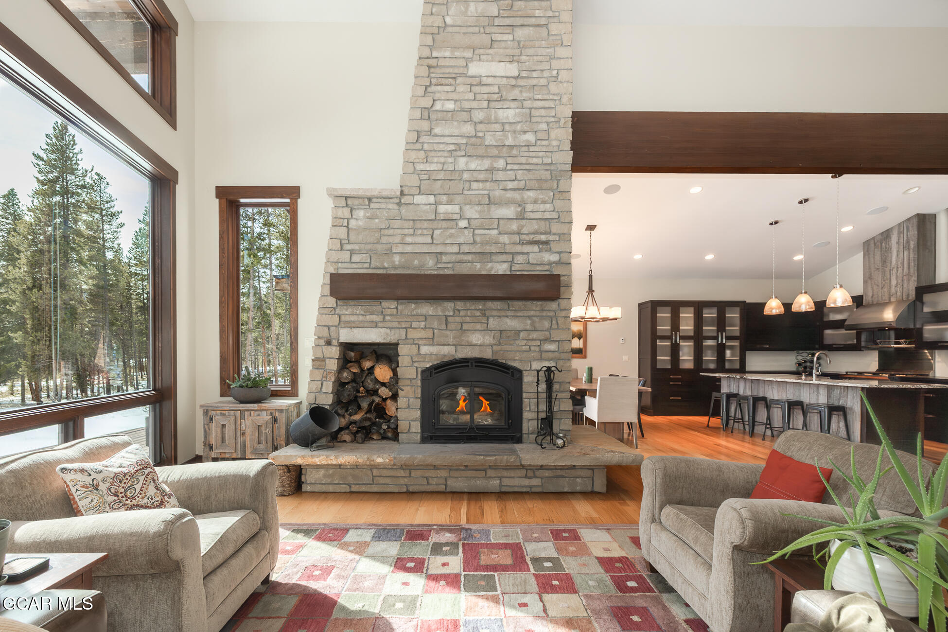492 Mountain Peak Road Tabernash, CO 80478 - Photo 7 of 29 a living room with furniture and a fireplace