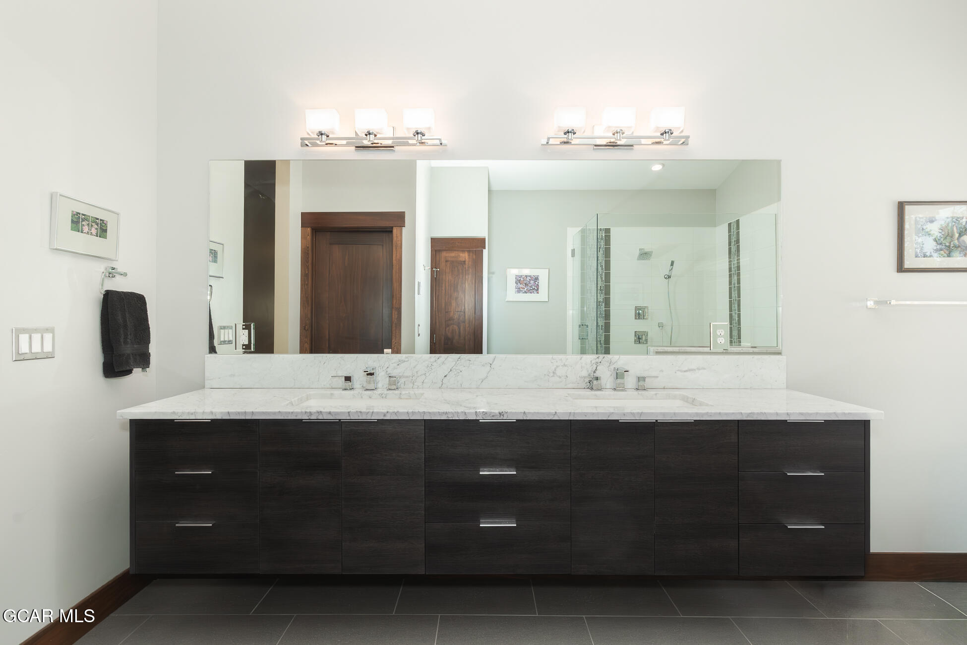 492 Mountain Peak Road Tabernash, CO 80478 - Photo 8 of 29 a bathroom with a double vanity sink and a mirror