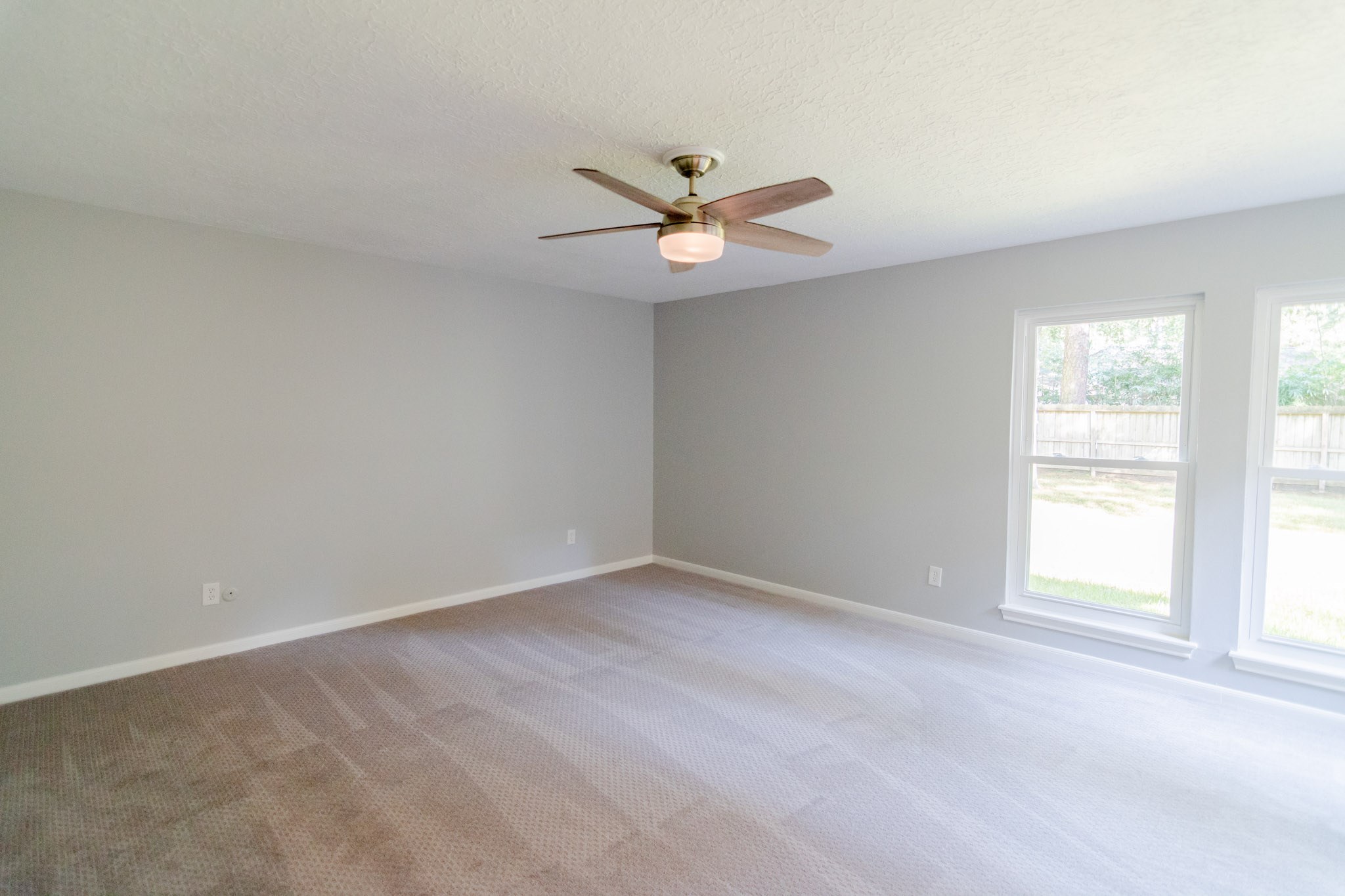 10 Coralvine Court Spring, TX 77380 - Photo 21 of 34 Primary suite is spacious with soft neutral gray walls to go with any decor.