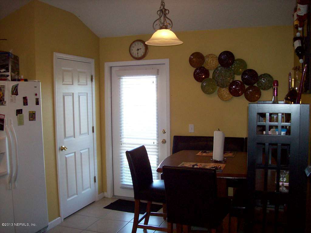 9183 Raptor Drive Jacksonville, FL 32221 - Photo 5 of 13 a dining room with furniture and window