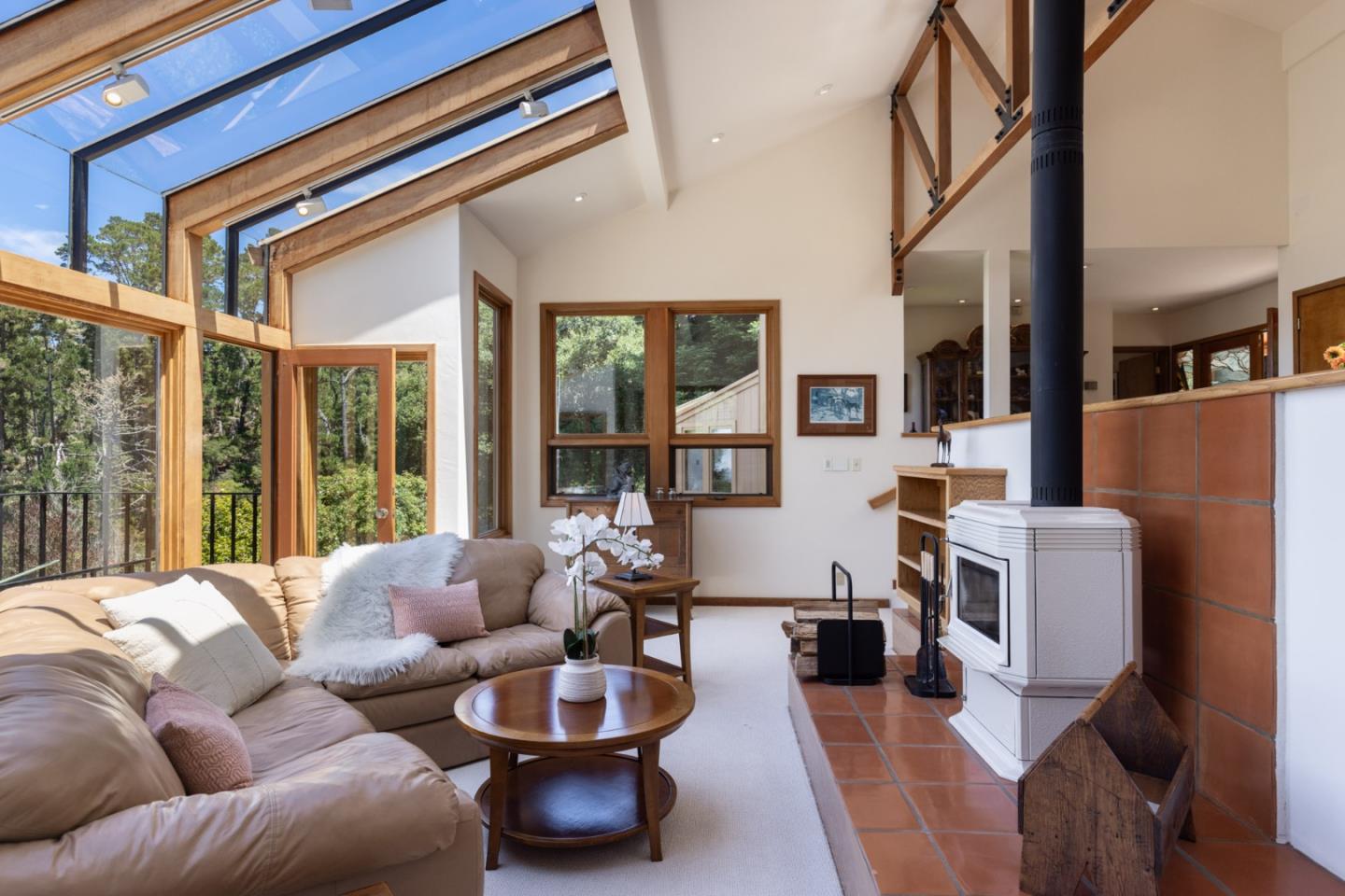 540 Aguajito Road Carmel, CA 93923 - Photo 11 of 32 a living room with furniture and a large window