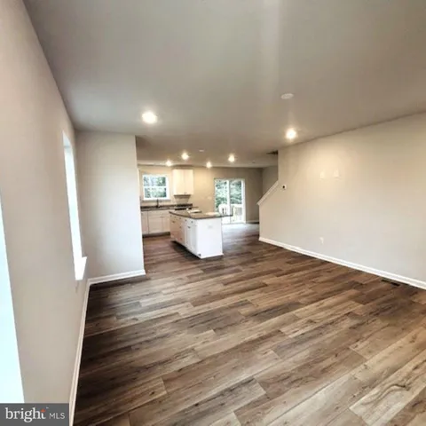 a view of kitchen and wooden floor