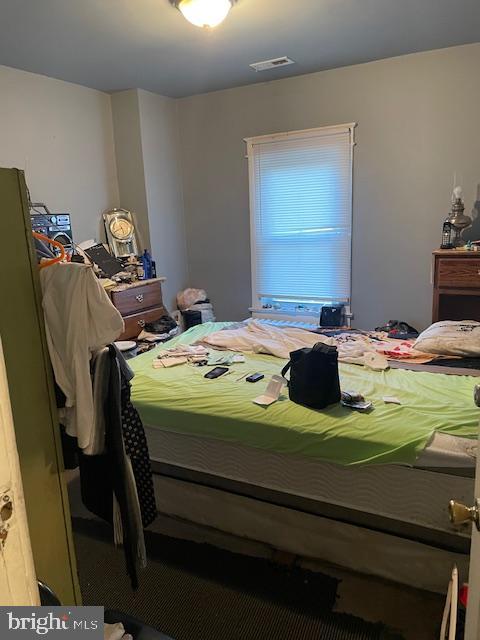 66 53rd Place Southeast Washington, DC 20019 - Photo 5 of 9 a bedroom with a bed and a table