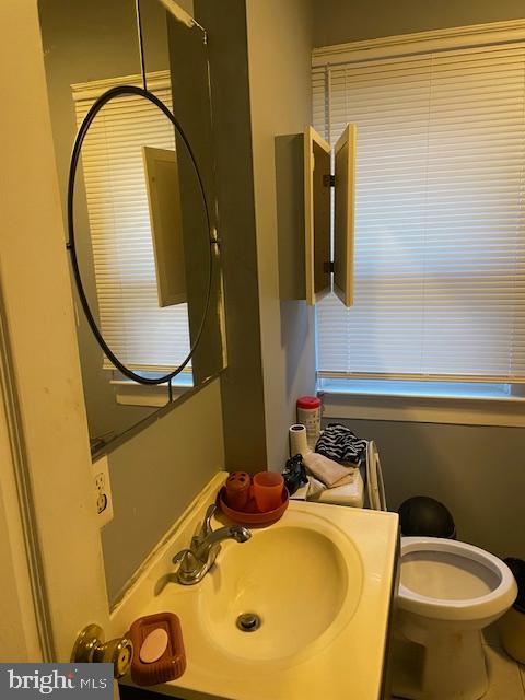 66 53rd Place Southeast Washington, DC 20019 - Photo 7 of 9 a bathroom with a sink and a mirror