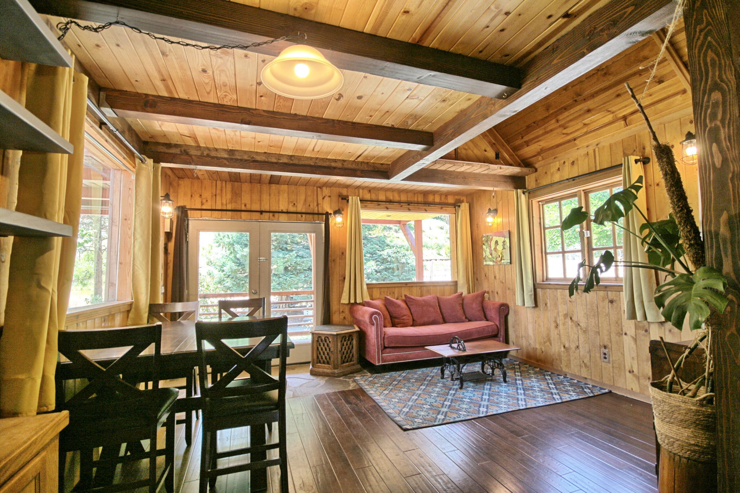 2231 Humbug Creek Road Jacksonville, OR 97530 - Photo 19 of 80 a living room with furniture and a large window