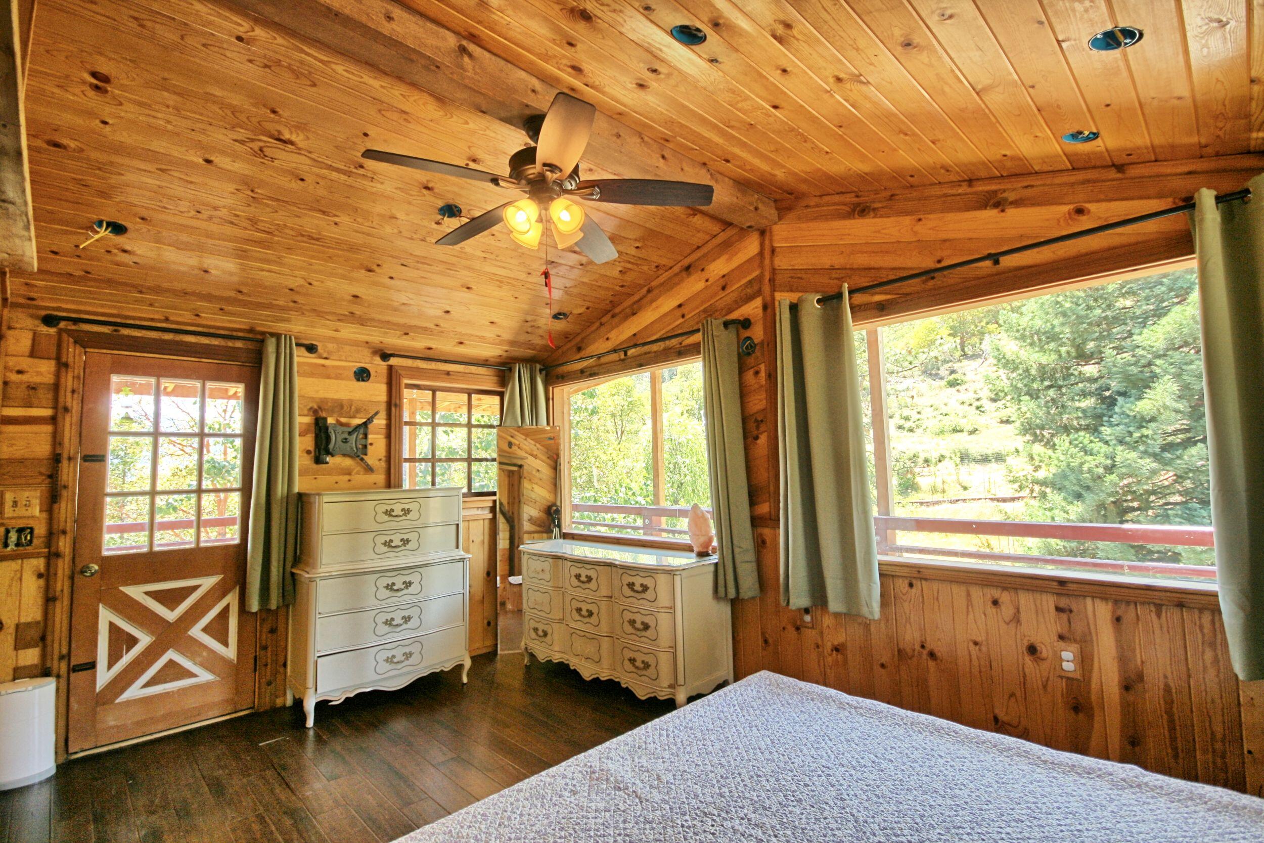 2231 Humbug Creek Road Jacksonville, OR 97530 - Photo 35 of 80 a bedroom with furniture and window