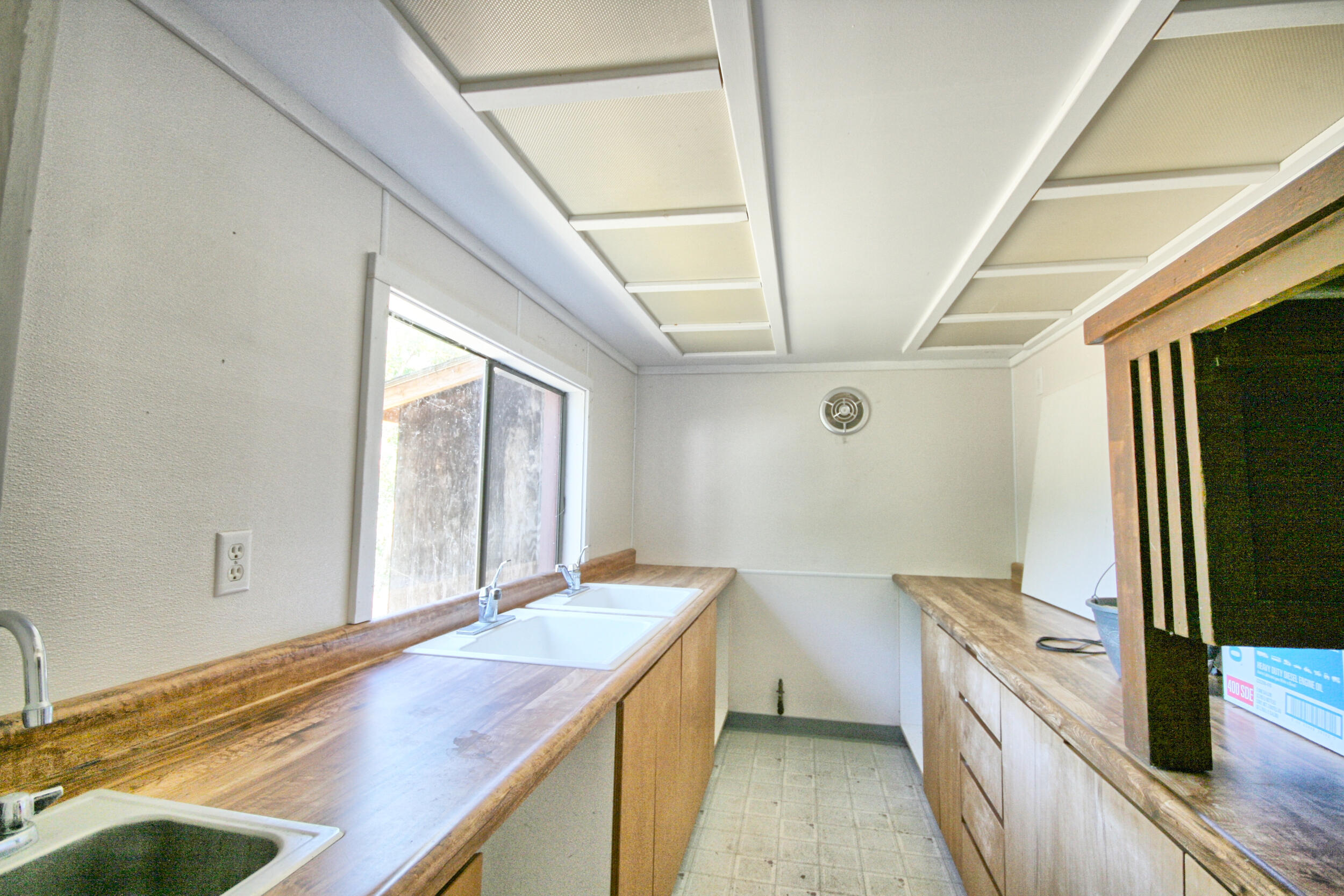 2231 Humbug Creek Road Jacksonville, OR 97530 - Photo 62 of 80 a bathroom with a granite countertop sink a large mirror and a bathtub