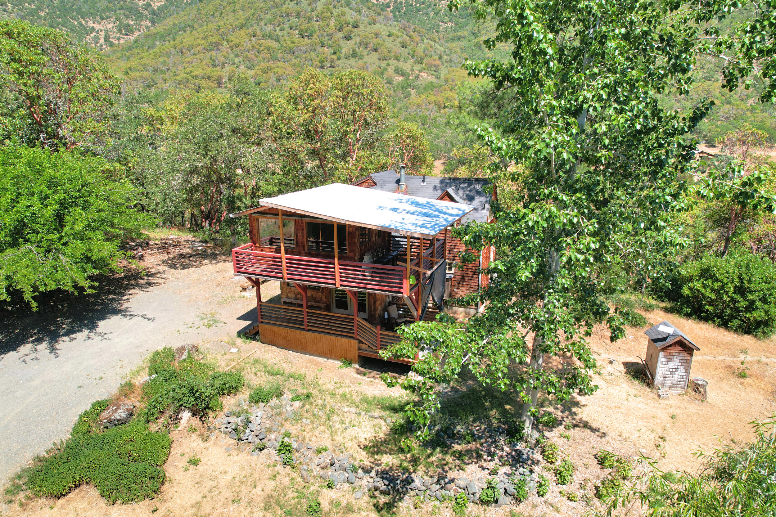2231 Humbug Creek Road Jacksonville, OR 97530 - Photo 10 of 80 an outdoor space with swimming pool and furniture