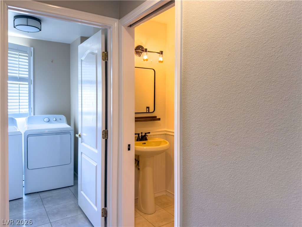 1842 Bogey Way Henderson, NV 89074 - Photo 11 of 25 Bathroom with light tile patterned flooring and independent washer and dryer