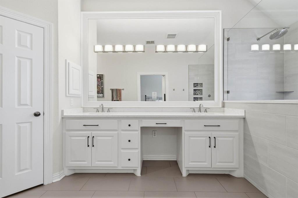 2619 Colby Street, Unit B Dallas, TX 75204 - Photo 16 of 34 a bathroom with a sink vanity and a mirror