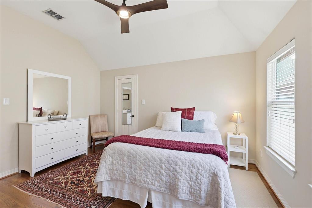 2619 Colby Street, Unit B Dallas, TX 75204 - Photo 18 of 34 a bedroom with a bed and a dresser