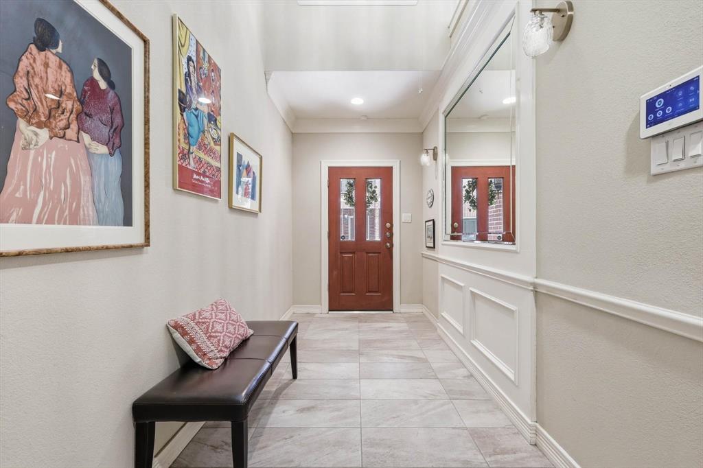 2619 Colby Street, Unit B Dallas, TX 75204 - Photo 22 of 34 a view of a hallway with paintings on the wall