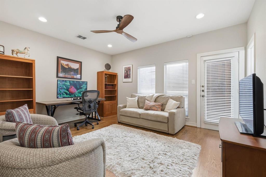 2619 Colby Street, Unit B Dallas, TX 75204 - Photo 23 of 34 a living room with furniture and a flat screen tv