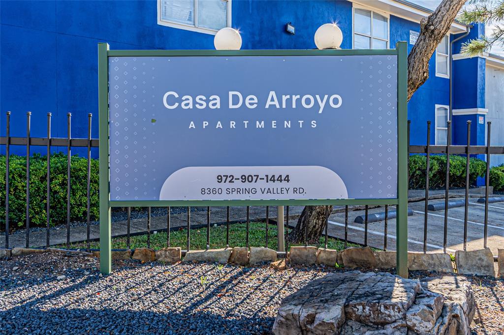8360 Spring Valley Road, Unit R Dallas, TX 75240 - Photo 2 of 3 a sign on the side of a building