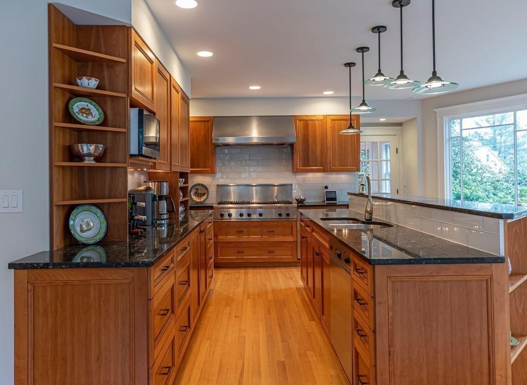 9 Blake Road Lexington, MA 02420 - Photo 15 of 41 a kitchen with stainless steel appliances granite countertop a sink stove and refrigerator