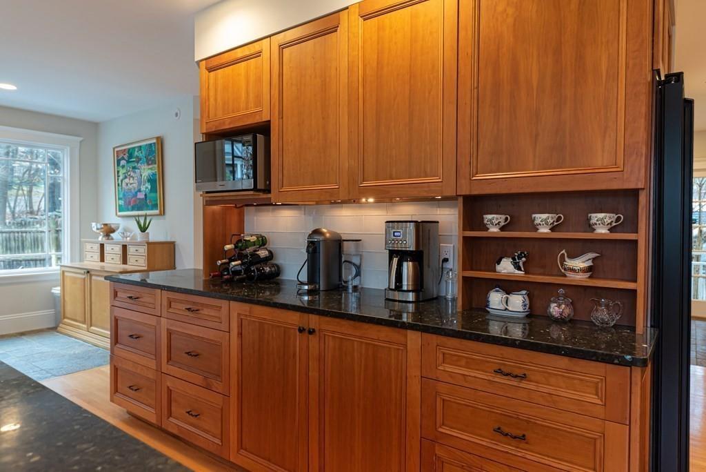 9 Blake Road Lexington, MA 02420 - Photo 18 of 41 a kitchen with stainless steel appliances a sink cabinets and a window