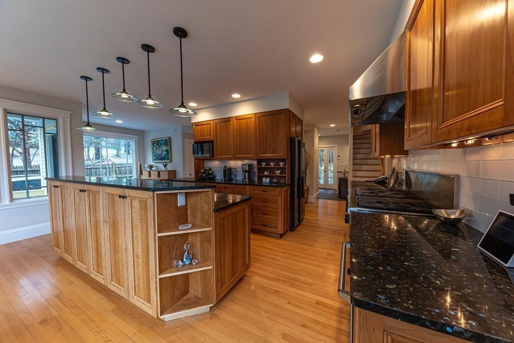 9 Blake Road Lexington, MA 02420 - Photo 19 of 41 a kitchen with stainless steel appliances granite countertop a stove a sink and a refrigerator