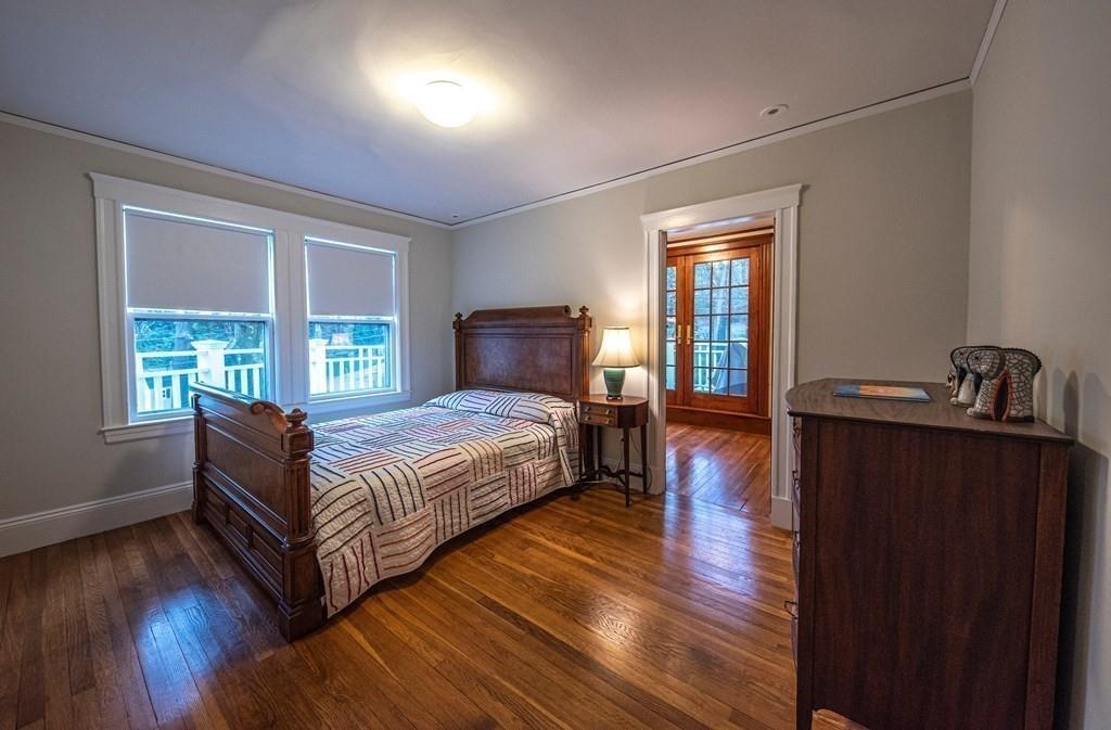 9 Blake Road Lexington, MA 02420 - Photo 27 of 41 a bedroom with a bed and wooden floor
