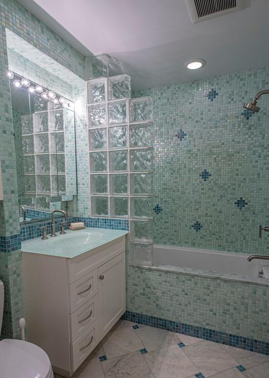 9 Blake Road Lexington, MA 02420 - Photo 29 of 41 a bathroom with a sink and a mirror