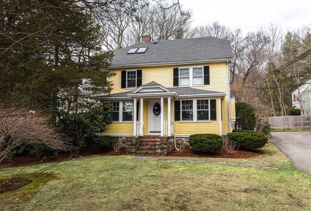 9 Blake Road Lexington, MA 02420 - Photo 3 of 41 a front view of a house with a garden