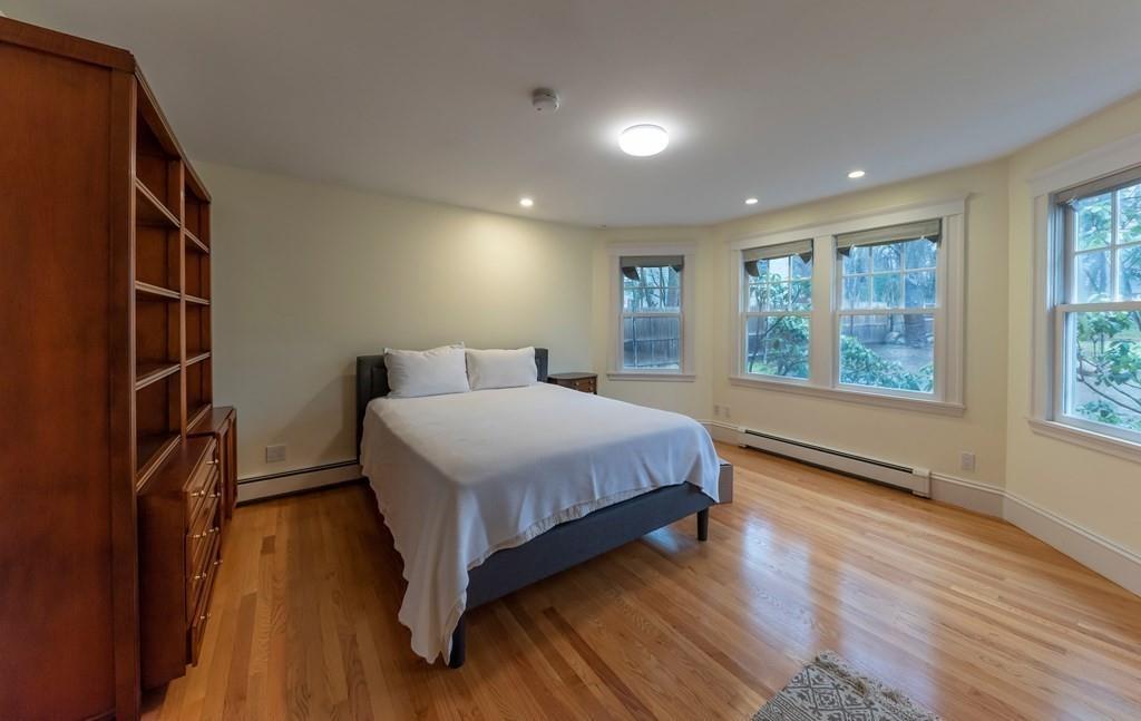 9 Blake Road Lexington, MA 02420 - Photo 32 of 41 a bedroom with a large bed and a large window