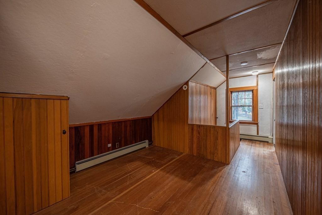 9 Blake Road Lexington, MA 02420 - Photo 38 of 41 a view of a hallway with wooden floor and staircase