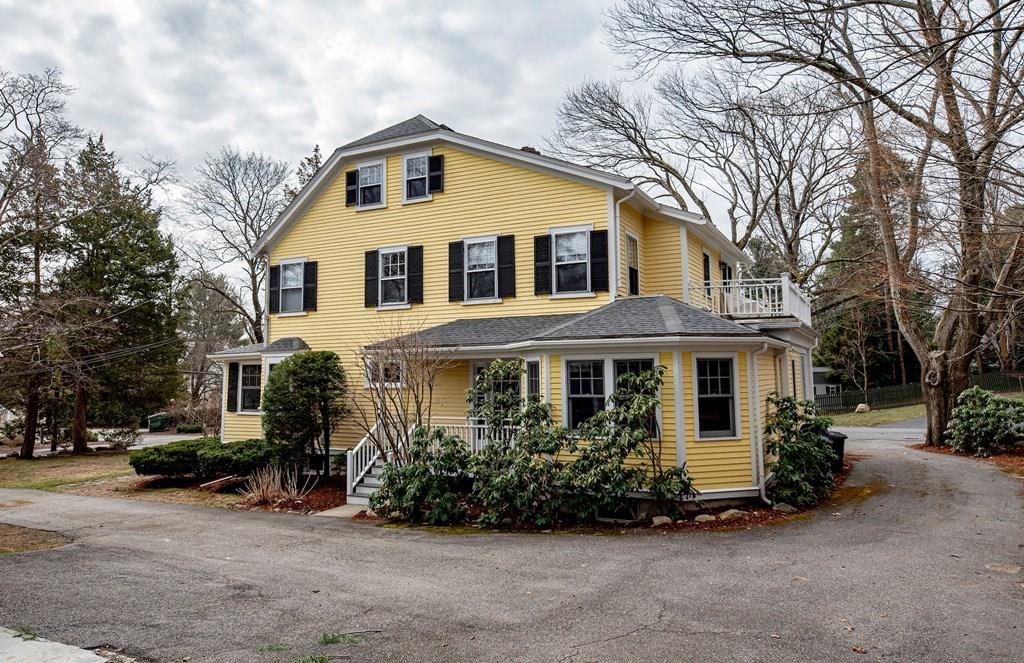 9 Blake Road Lexington, MA 02420 - Photo 4 of 41 a front view of a house with a garden