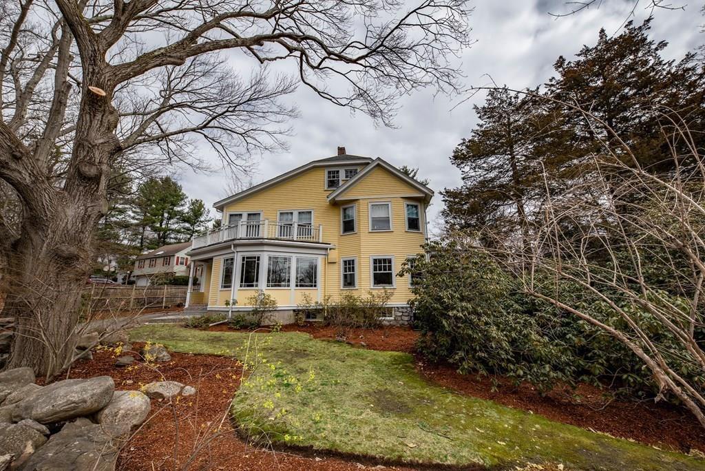 9 Blake Road Lexington, MA 02420 - Photo 5 of 41 a front view of a house with a yard