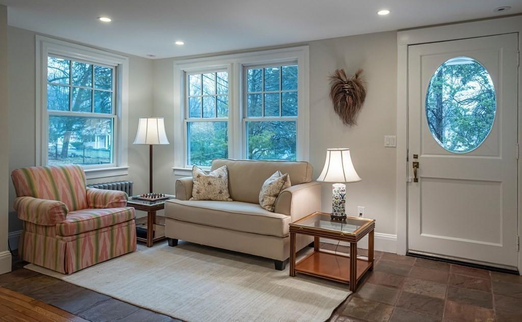 9 Blake Road Lexington, MA 02420 - Photo 7 of 41 a living room with furniture and a large window