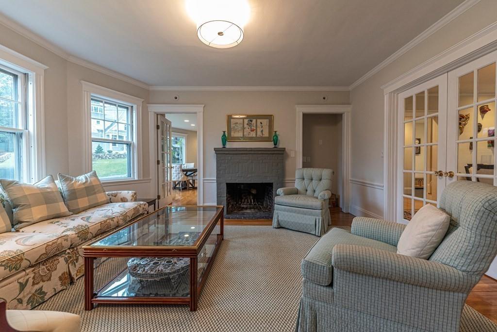 9 Blake Road Lexington, MA 02420 - Photo 10 of 41 a living room with furniture and a fireplace