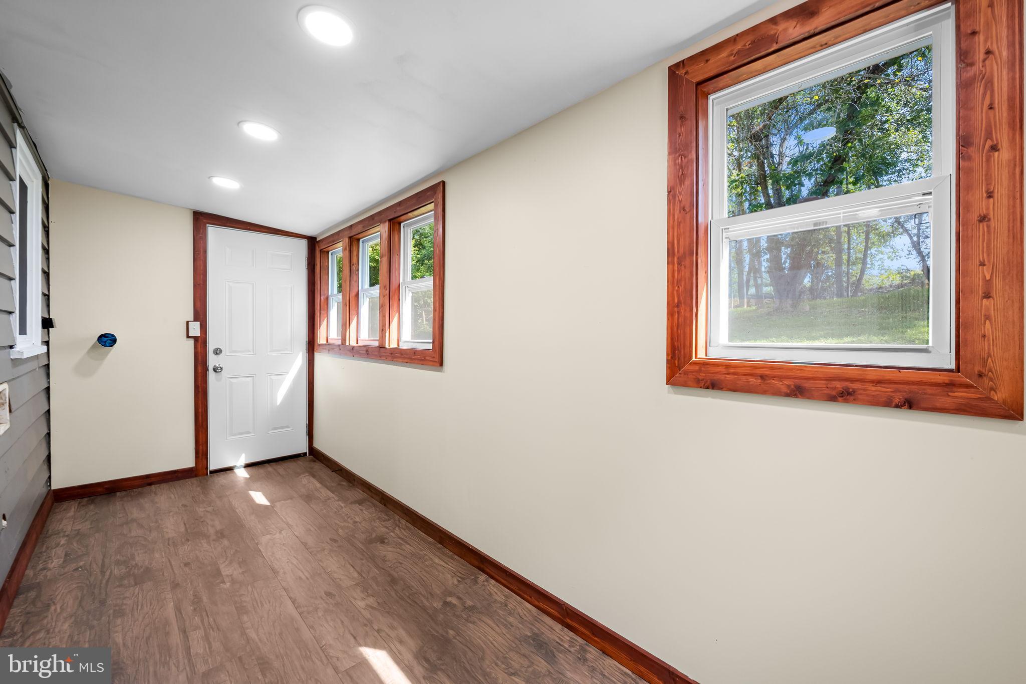 4831 Conowingo Road Darlington, MD 21034 - Photo 12 of 37 a view of an empty room with wooden floor and a window