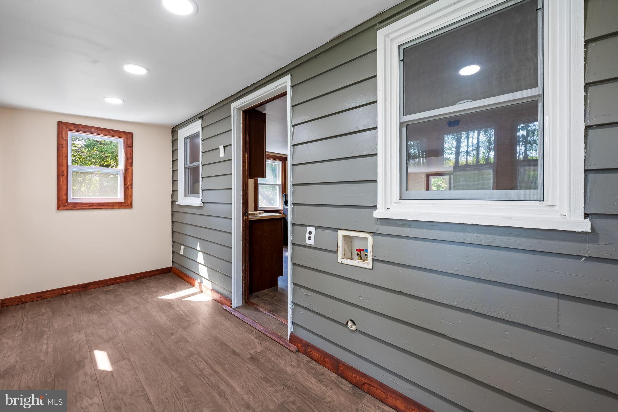 4831 Conowingo Road Darlington, MD 21034 - Photo 13 of 37 a view of an entryway with wooden floor and windows