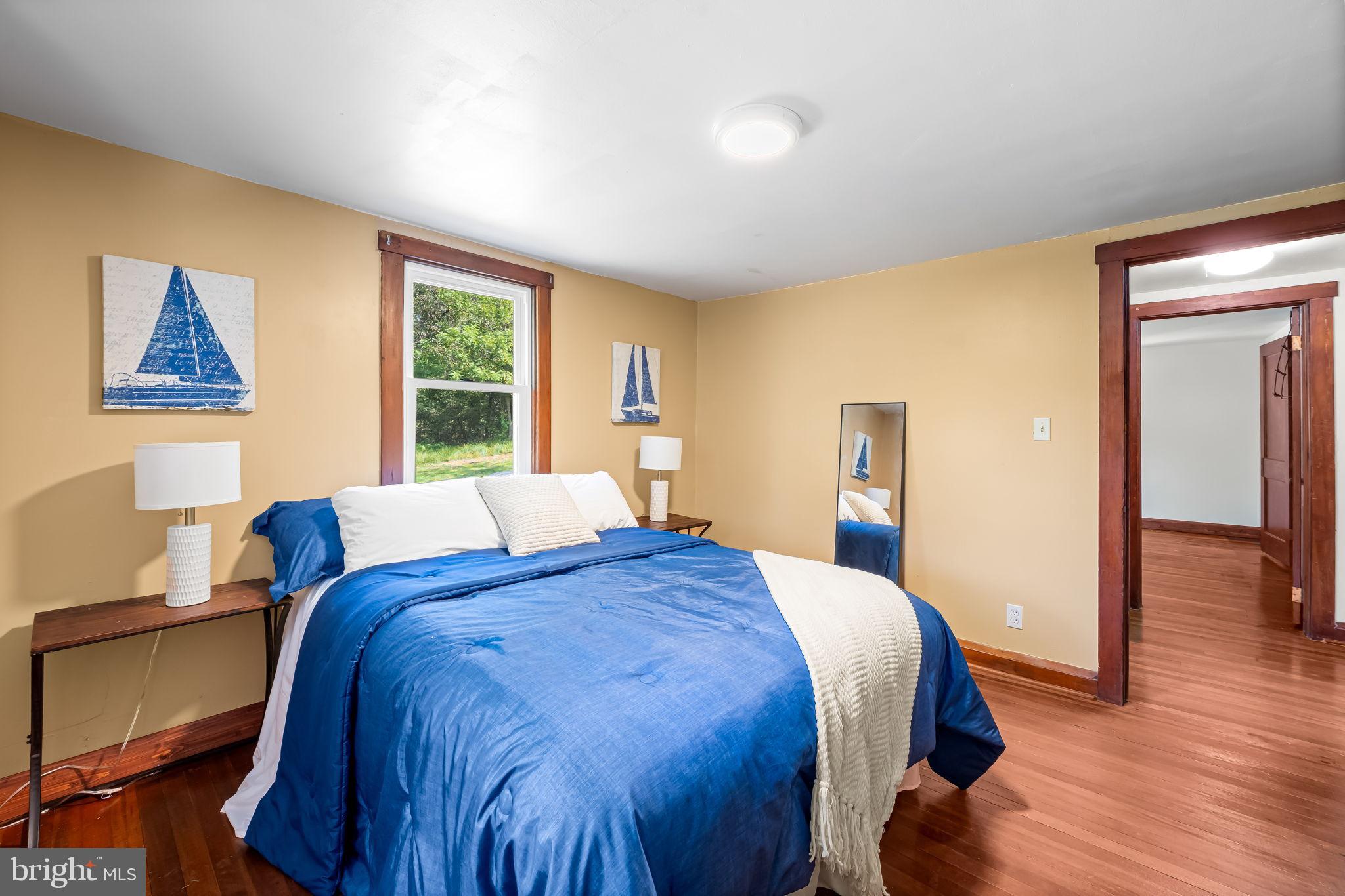 4831 Conowingo Road Darlington, MD 21034 - Photo 15 of 37 a bedroom with a bed and wooden floor