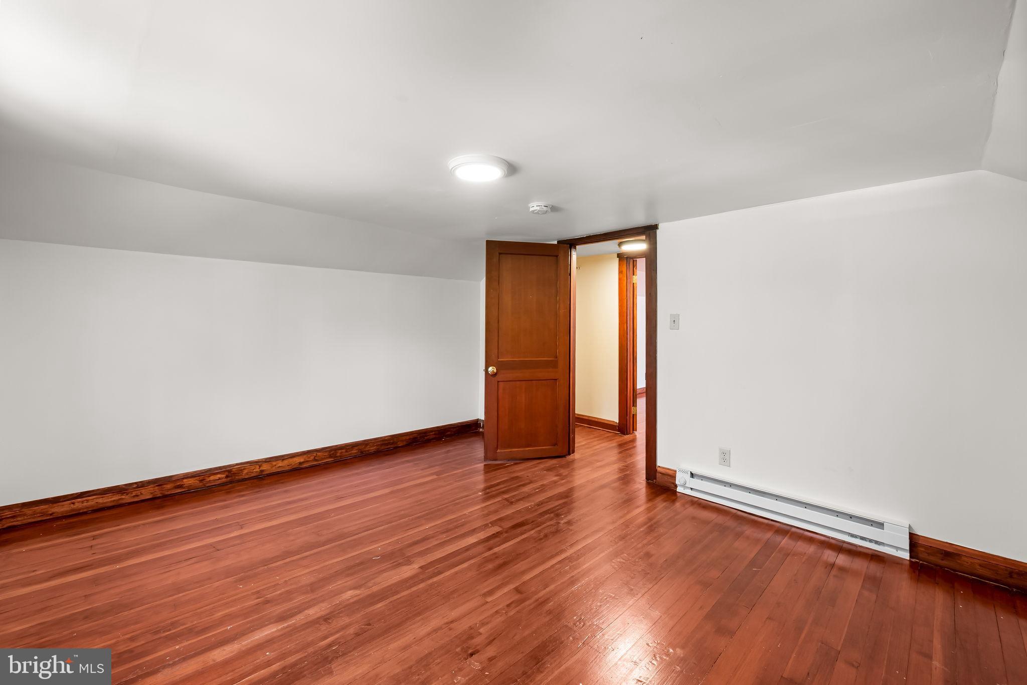4831 Conowingo Road Darlington, MD 21034 - Photo 22 of 37 a view of an empty room with wooden floor