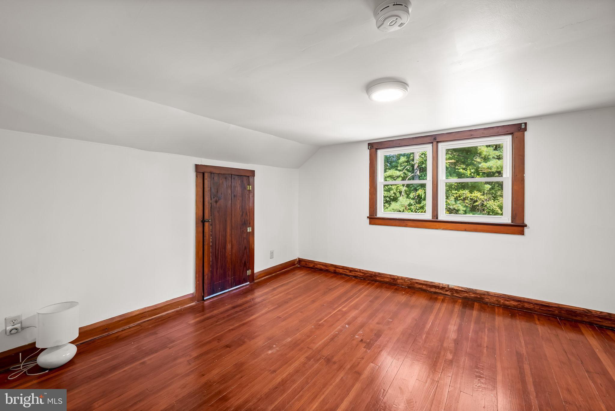 4831 Conowingo Road Darlington, MD 21034 - Photo 23 of 37 an empty room with wooden floor and windows