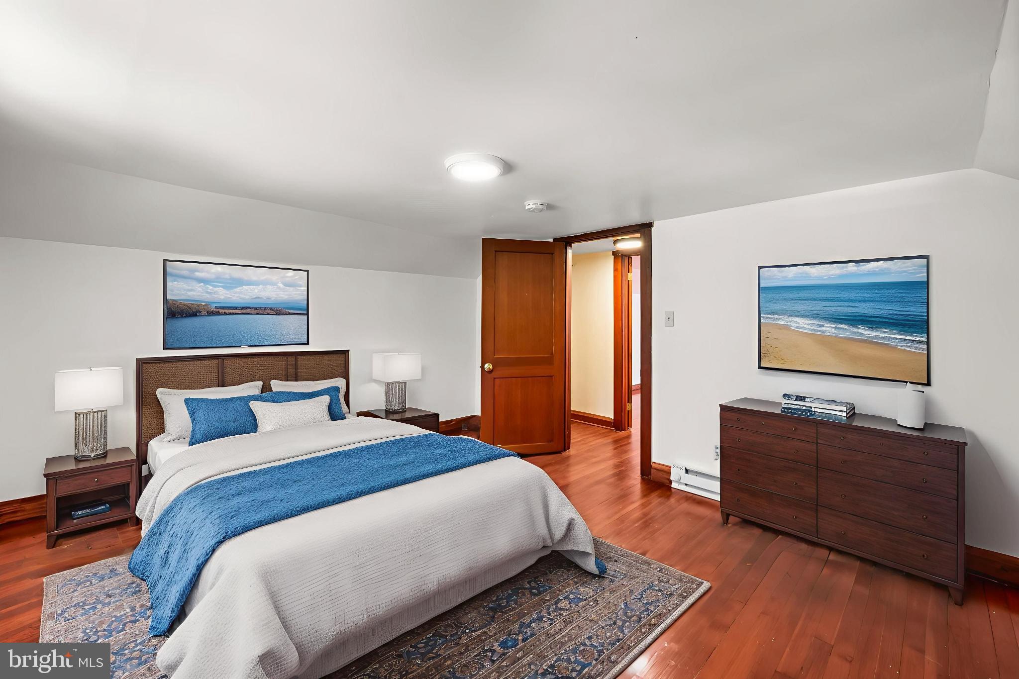 4831 Conowingo Road Darlington, MD 21034 - Photo 24 of 37 a bedroom with a bed dresser and wooden floor