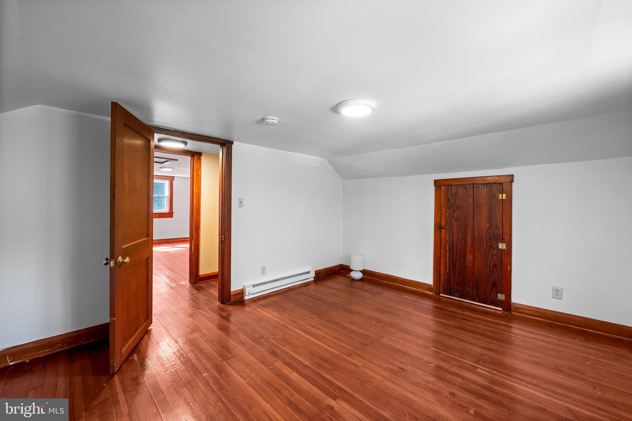 4831 Conowingo Road Darlington, MD 21034 - Photo 25 of 37 an empty room with wooden floor and closet