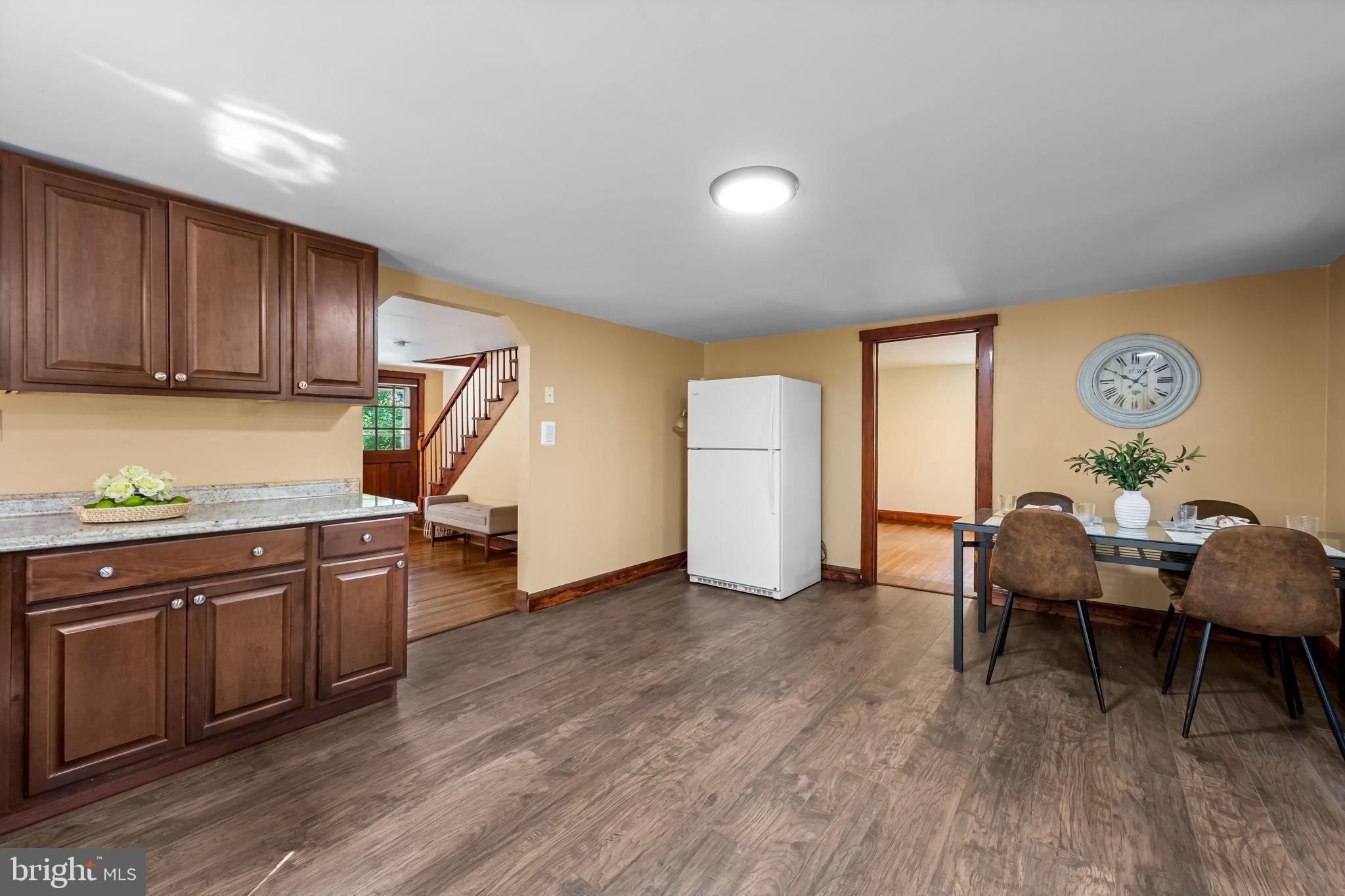 4831 Conowingo Road Darlington, MD 21034 - Photo 9 of 37 a kitchen with stainless steel appliances granite countertop a sink dishwasher and a stove with wooden floor