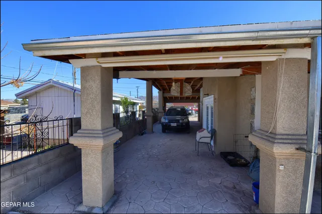 an aerial view of a house with a yard swimming pool and outdoor seating