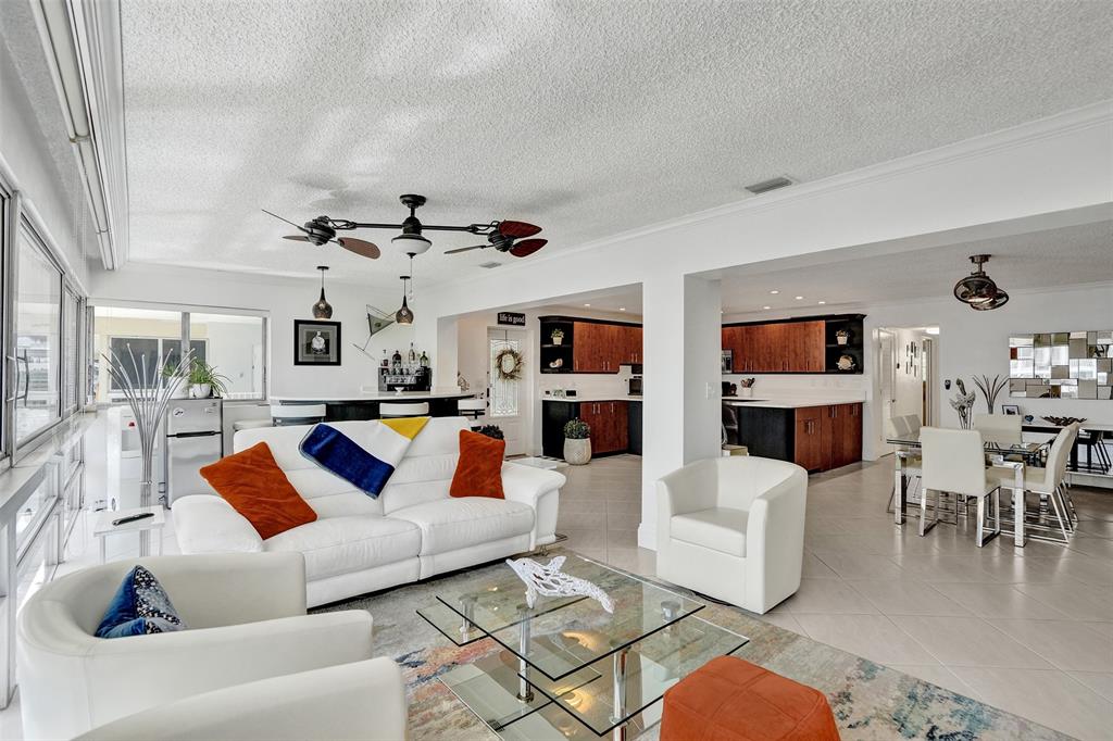 3090 Northeast 48th Street, Unit 316 Fort Lauderdale, FL 33308 - Photo 21 of 49 a living room with furniture or couch and a rug