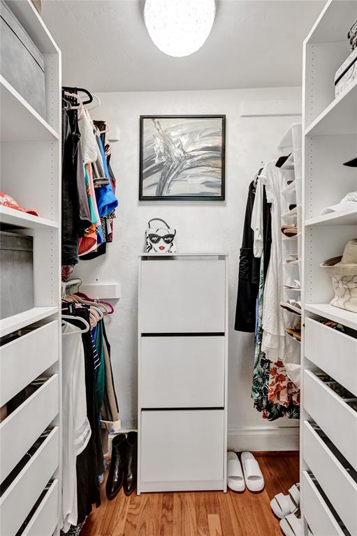 3090 Northeast 48th Street, Unit 316 Fort Lauderdale, FL 33308 - Photo 27 of 49 a view of walk in closet with clothes and shoes
