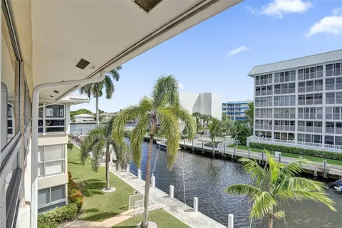 a view of a lake with a building in the background