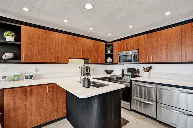 a kitchen with a sink cabinets and window