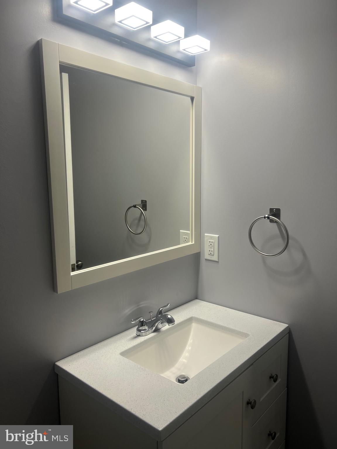 2600 Kingsway Road Fort Washington, MD 20744 - Photo 16 of 37 a bathroom with a sink and a mirror