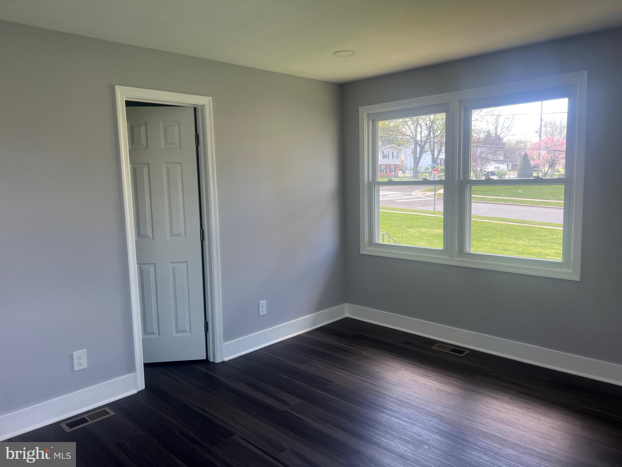 2600 Kingsway Road Fort Washington, MD 20744 - Photo 18 of 37 a view of an empty room with wooden floor and a window