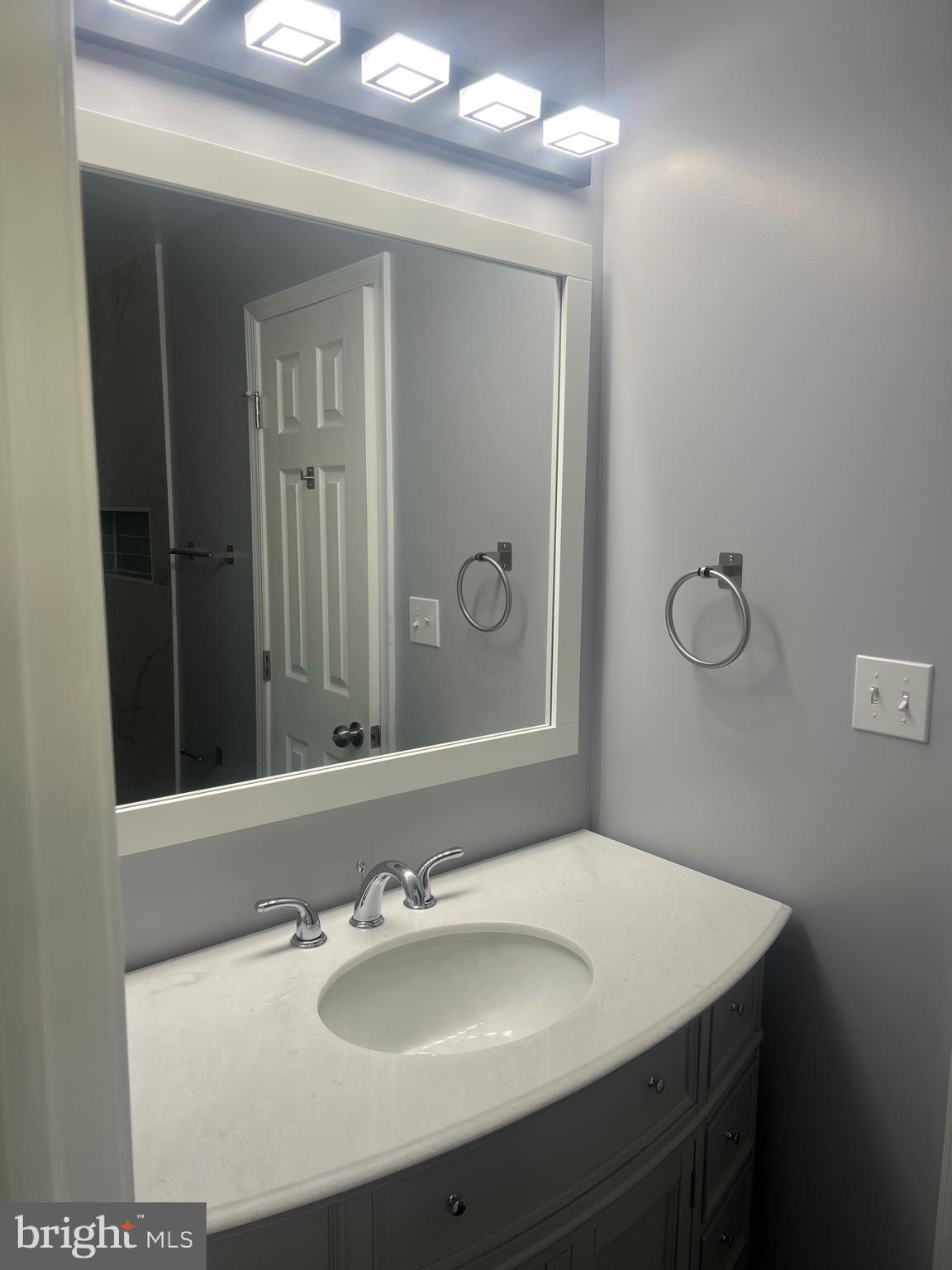 2600 Kingsway Road Fort Washington, MD 20744 - Photo 19 of 37 a bathroom with a sink and a mirror