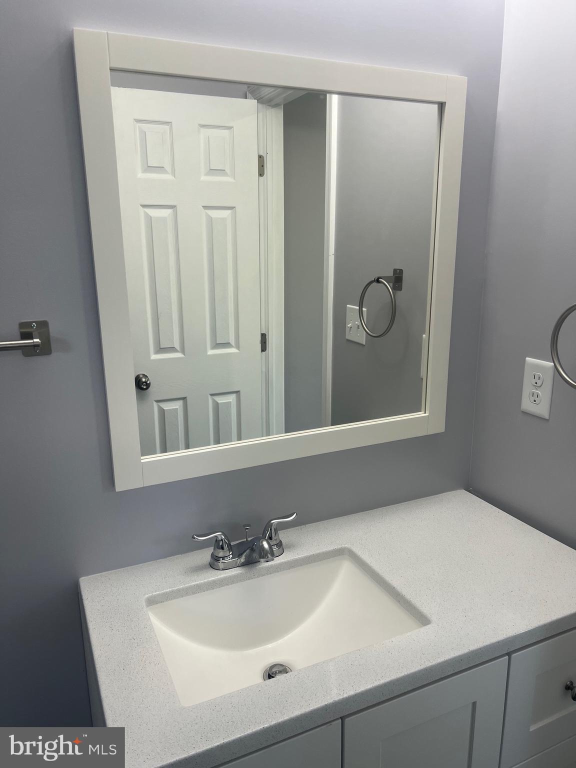 2600 Kingsway Road Fort Washington, MD 20744 - Photo 24 of 37 a bathroom with a sink and a mirror